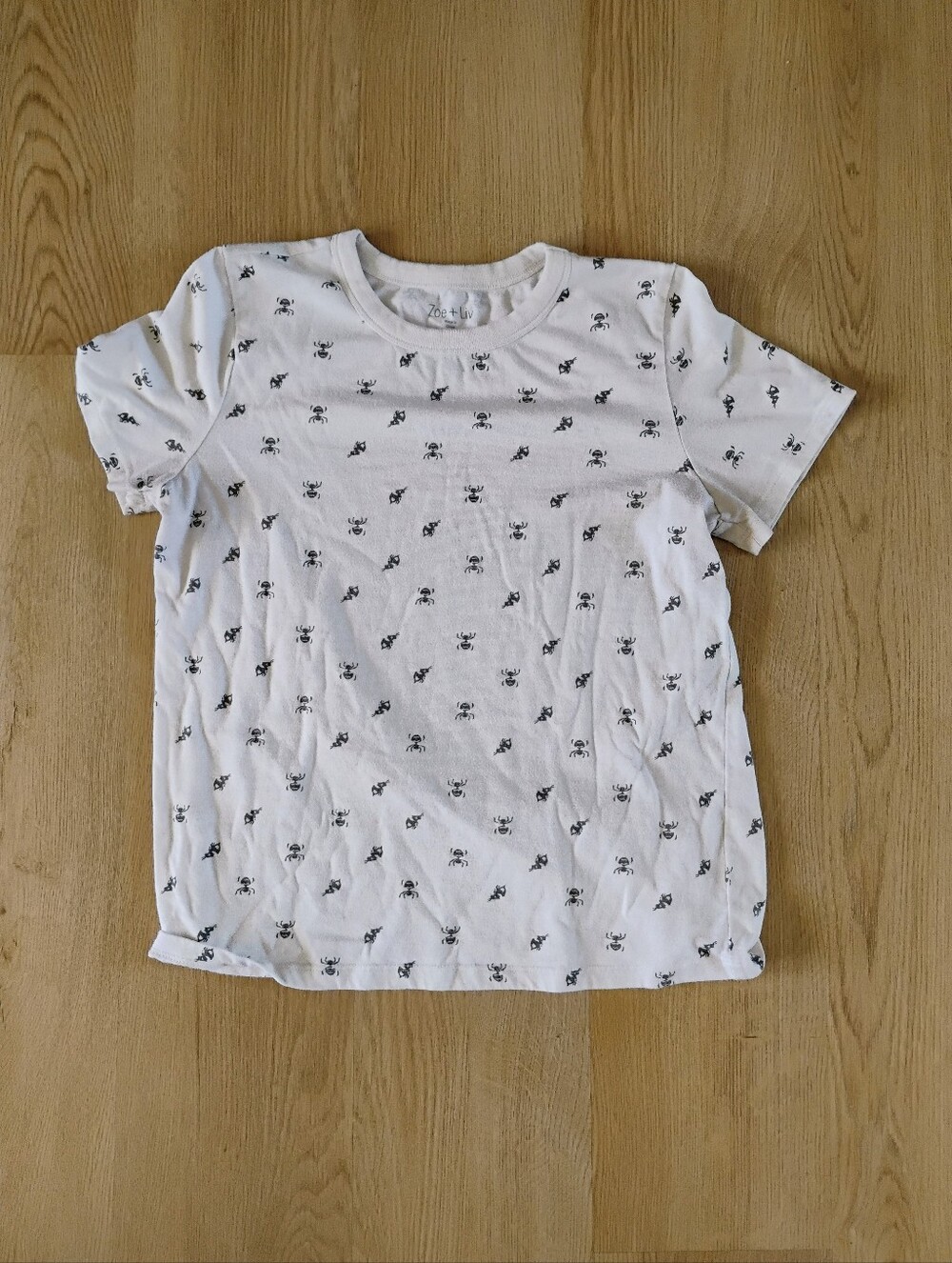 Zoe + Liv White Short Sleeve Tee with Black Bee Pattern